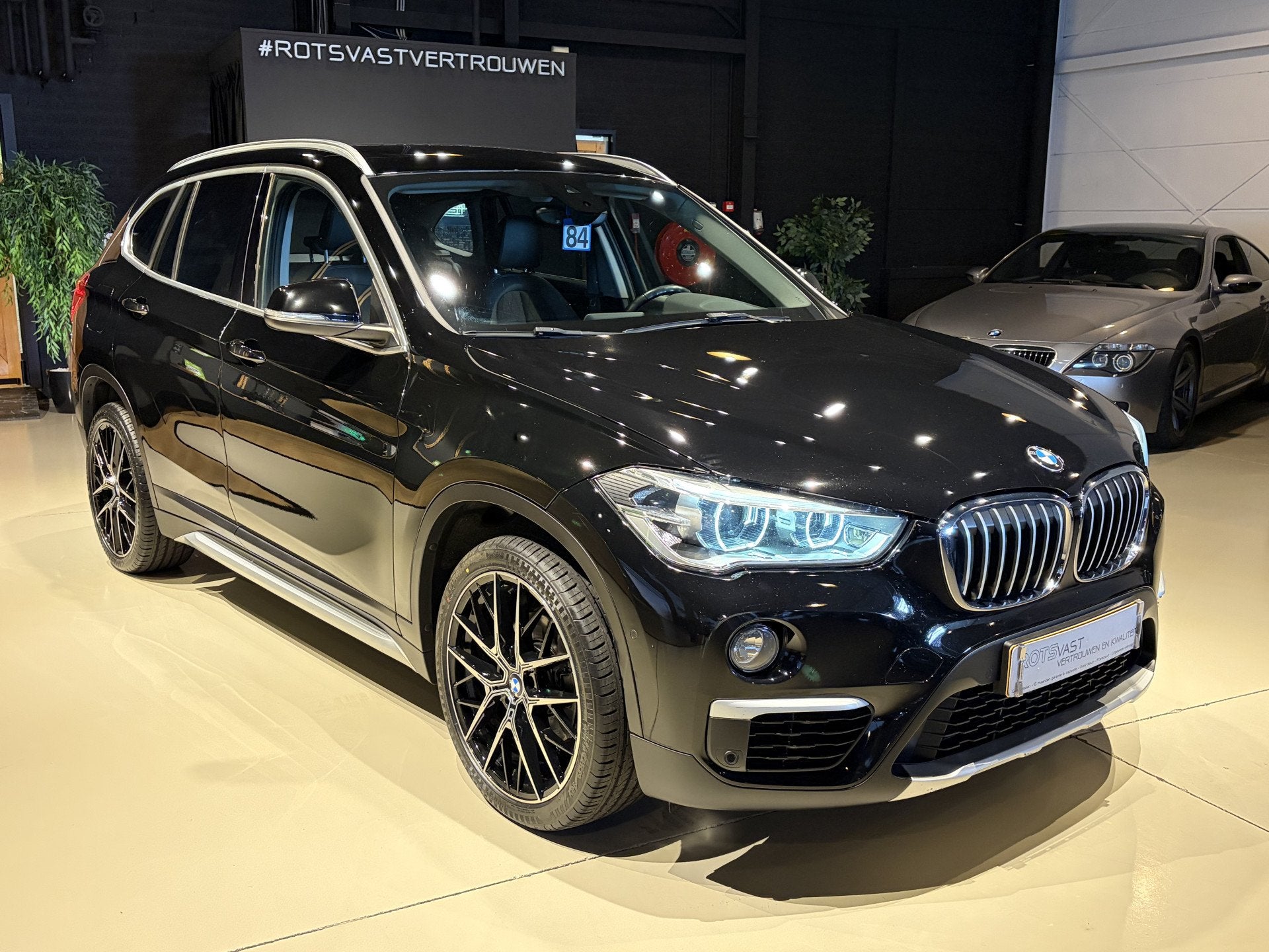 BMW X1 sDrive 1.8i Exe Aut Navi|LED|Cruis|PDC|Camera Zwart, Auto's, BMW, Gebruikt, Huisgarantie, Met garantie (alle), Bedrijf