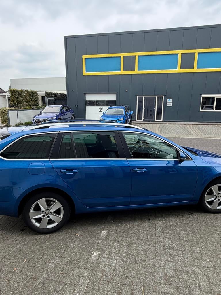 Skoda Octavia 1.6 TDI 81KW Combi 2014 Blauw, Voorwielaandrijving, Stof, Zwart, 4 cilinders