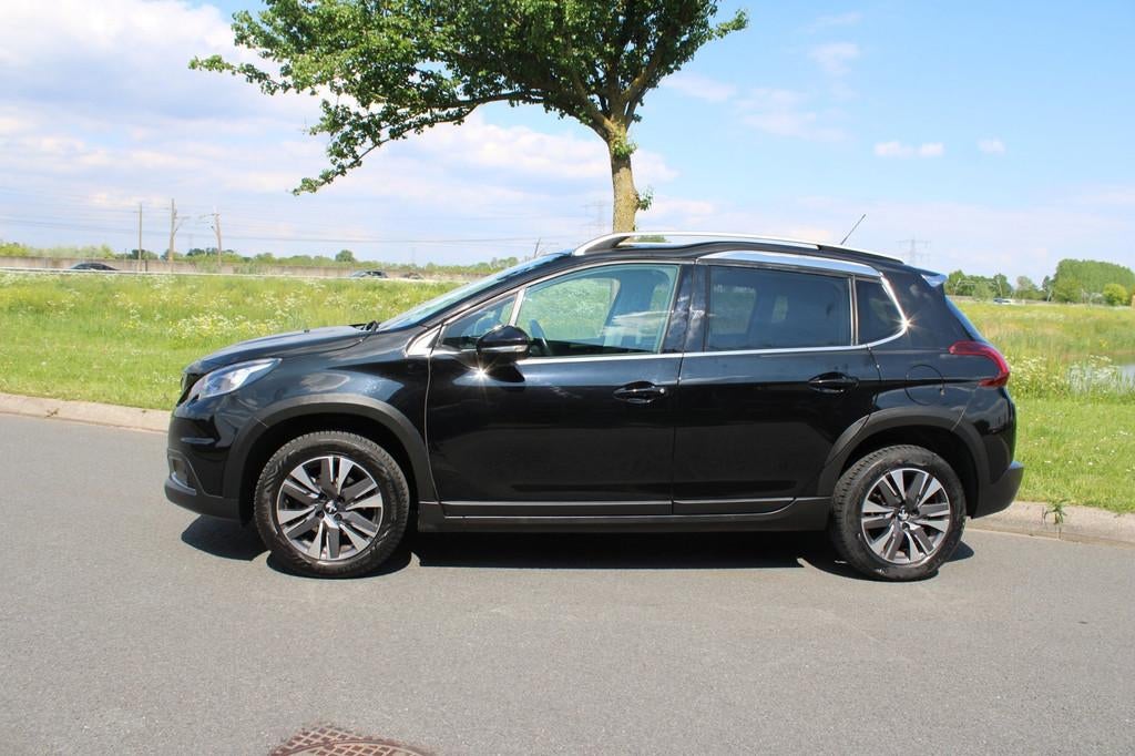 Peugeot 2008 1.2 PureTech Allure Climate Control Navigatie A, Voorwielaandrijving, 1199 cc, Leder en Stof, Zwart