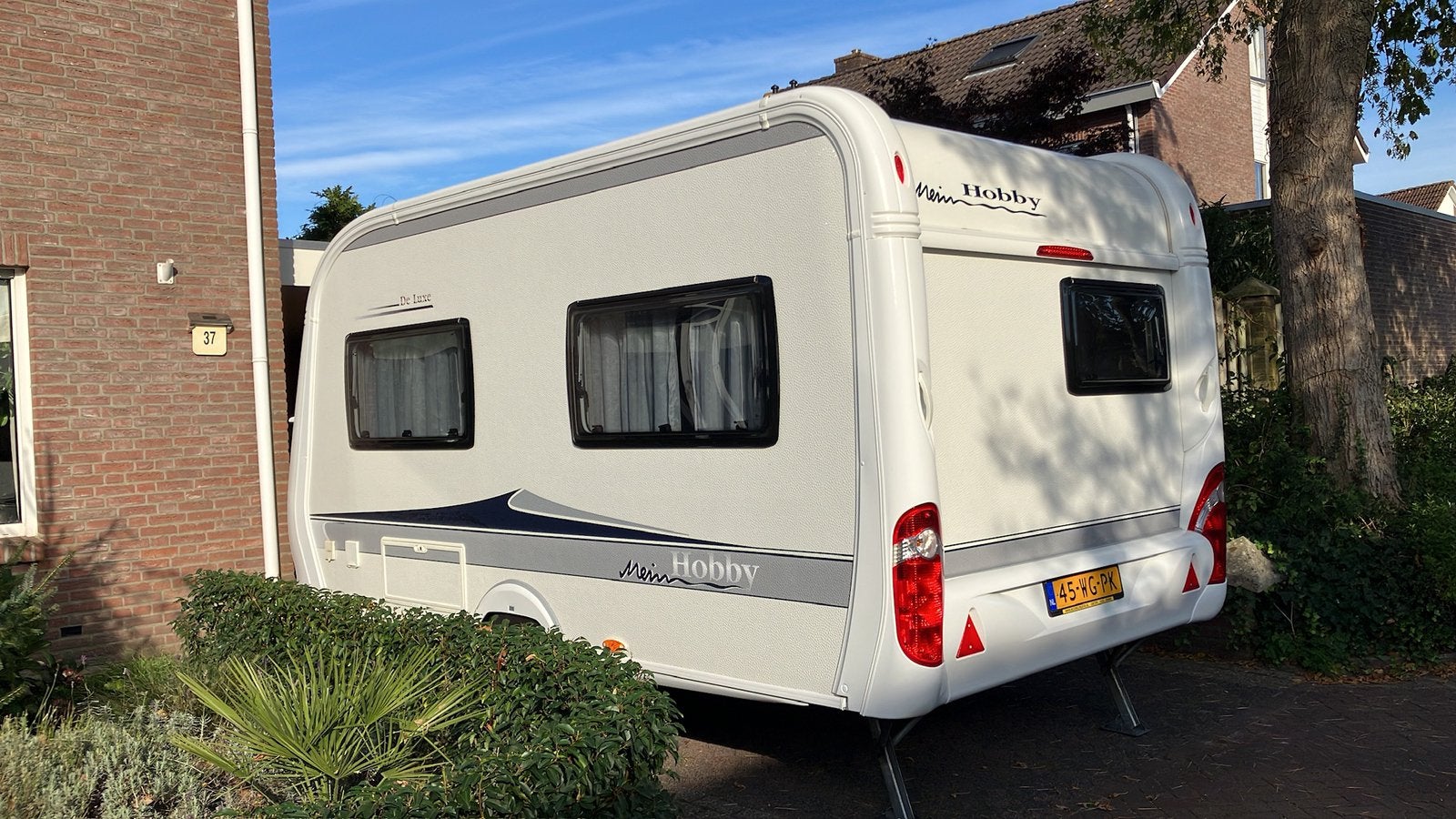 Te koop mooie hobby caravan de luxe 400 SFE.  2012, Hobby, Treinzit, Particulier, 4 tot 5 meter