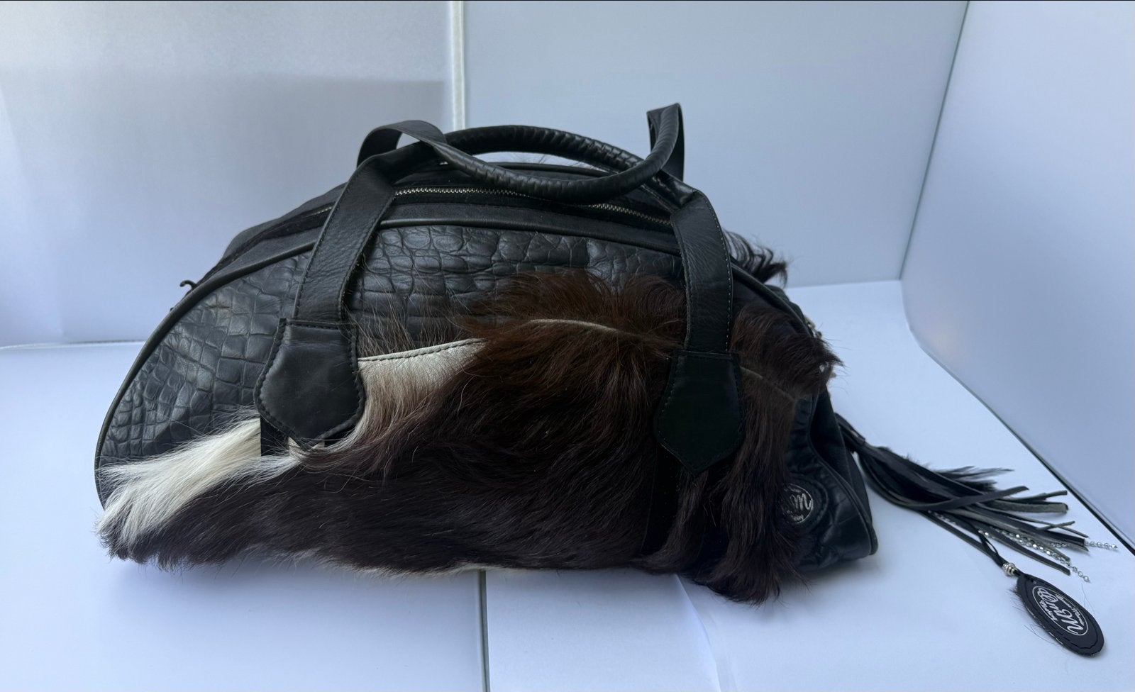 Vintage Omar Munie tas van echt leer met kalfshaar, Ophalen of Verzenden, Gebruikt, Zwart, Handtas