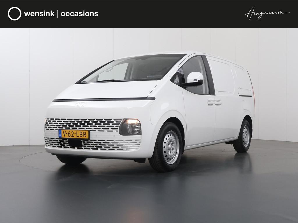 Hyundai Staria 1.6 T-GDI | AUT. | HEV | HYBRIDE | BENZINE |, Stof, Gebruikt, 4 cilinders, Wit