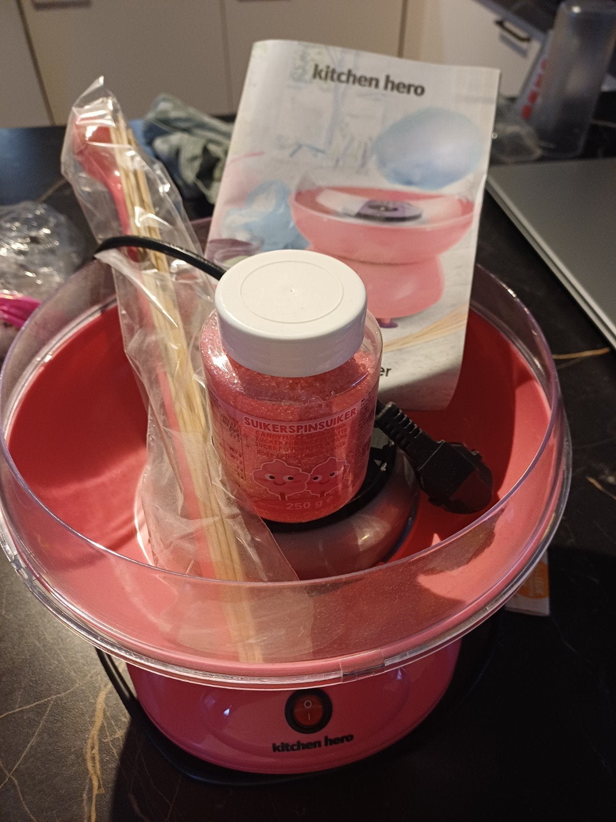 suikerspin machine, Ophalen