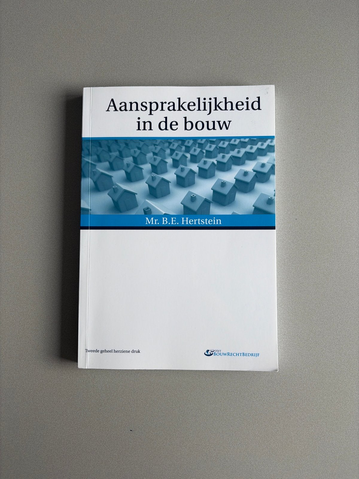 Aansprakelijkheid in de bouw - Mr. B.E. Hertstein, Boeken, Ophalen, Zo goed als nieuw, Bouwkunde