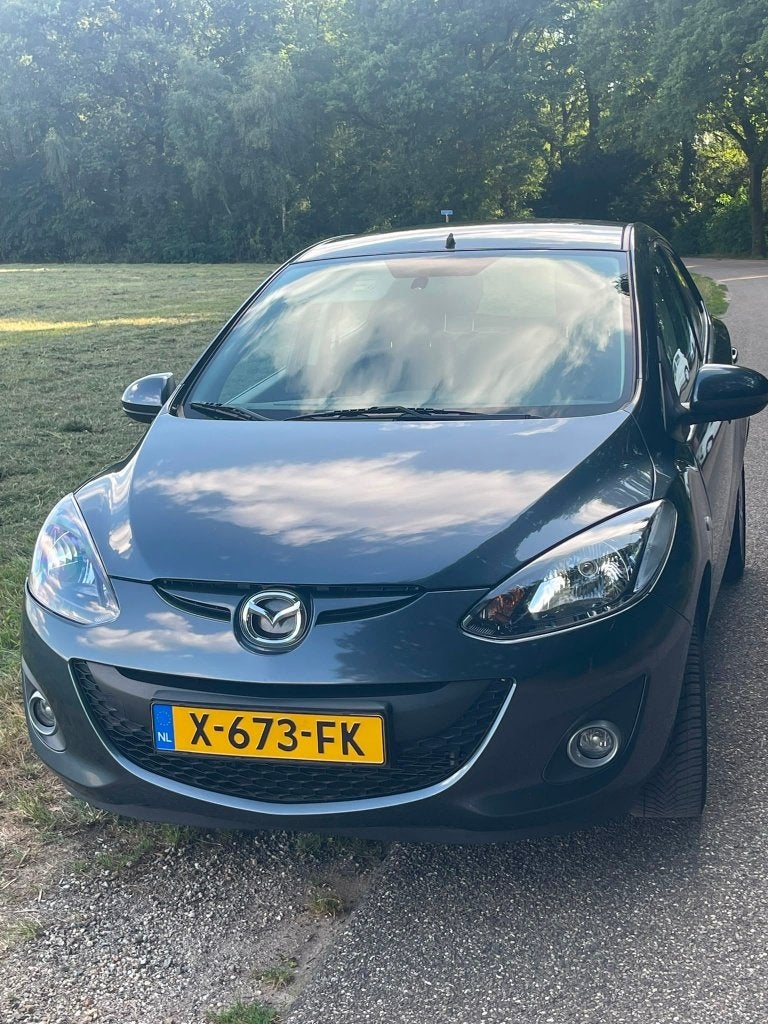 Mazda 2 1.5 75KW 5DRS AUT 2012 Grijs, Stof, Zwart, 4 cilinders, Particulier