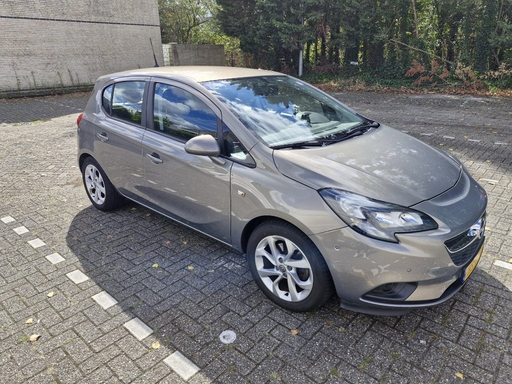 Opel Corsa 1.0T 66KW/90PK 5D 2015 Bruin, Auto's, Voorwielaandrijving, Stof, Bruin, Origineel Nederlands