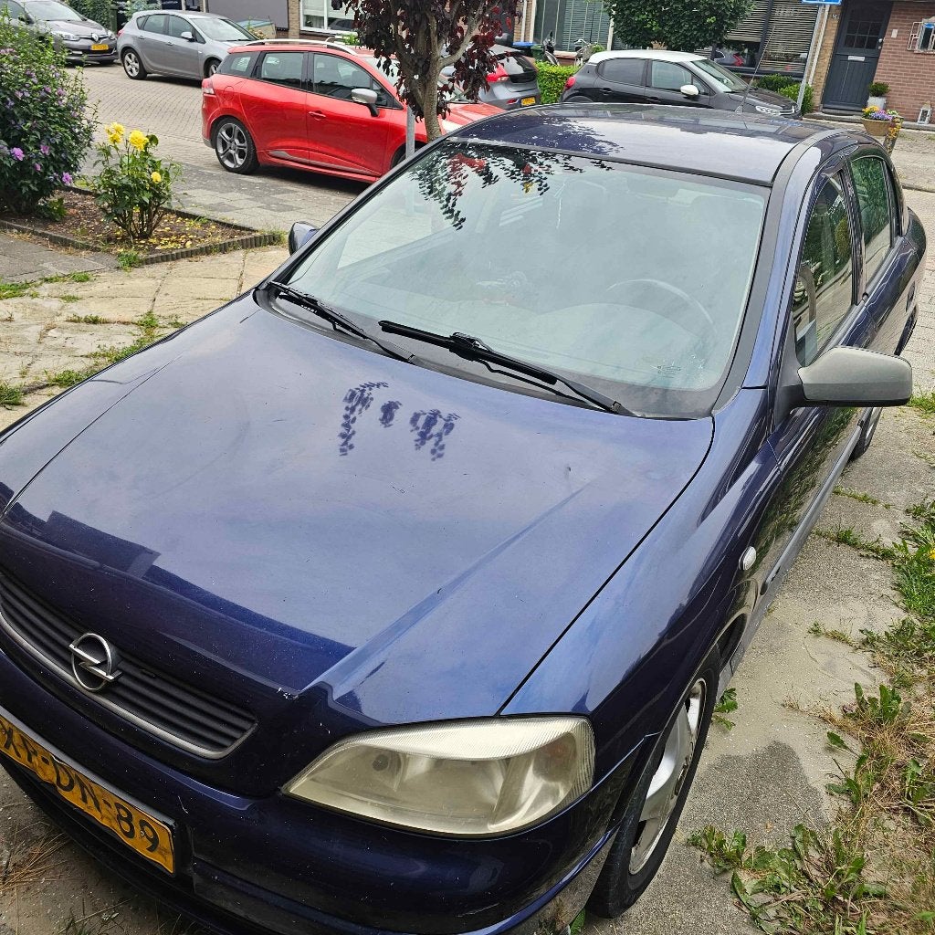Opel Astra 1.6 I 16V AUT 1999 Blauw, Auto's, Stof, 4 cilinders, 1095 kg, Blauw