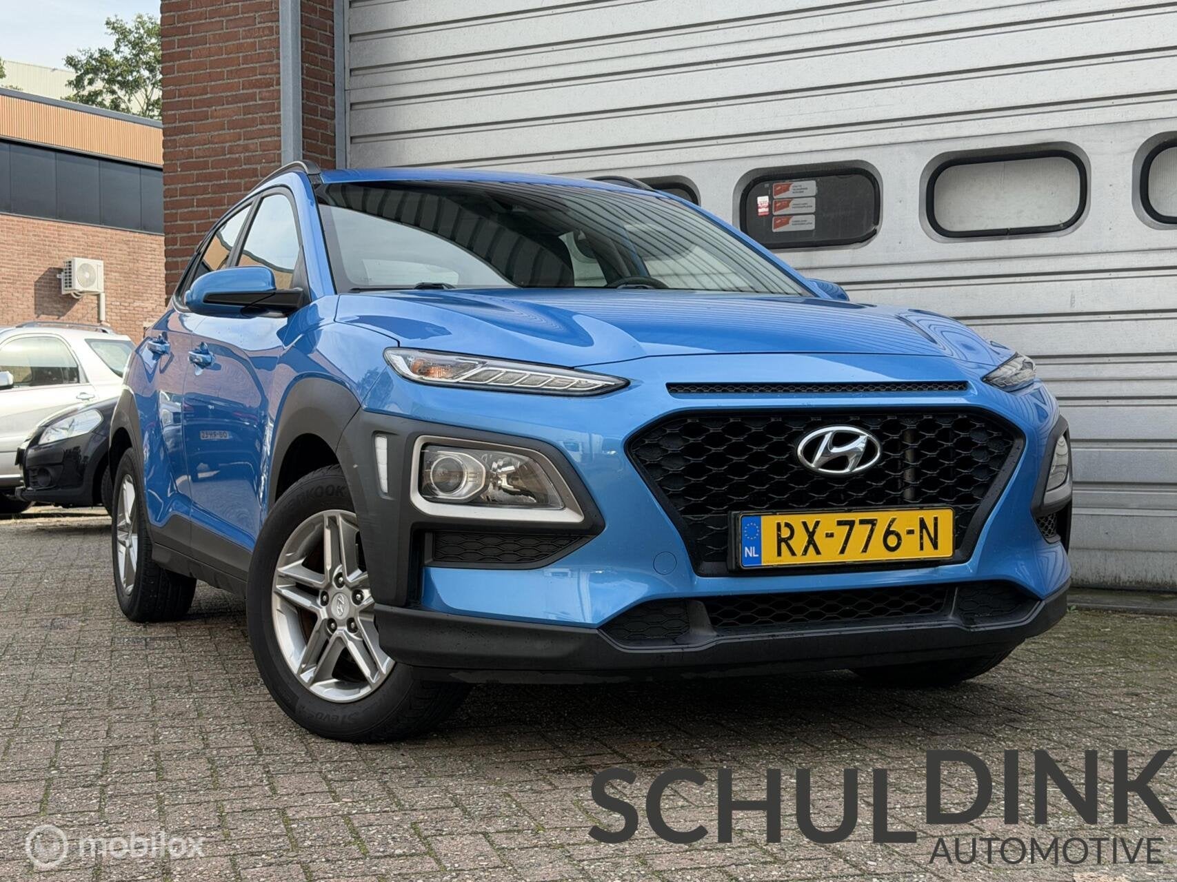 Hyundai Kona 1.0T Comfort CRUISE CONTROLE|ACHTERCAMERA|AIRCO, Auto's, Voorwielaandrijving, Gebruikt, Euro 6, Blauw