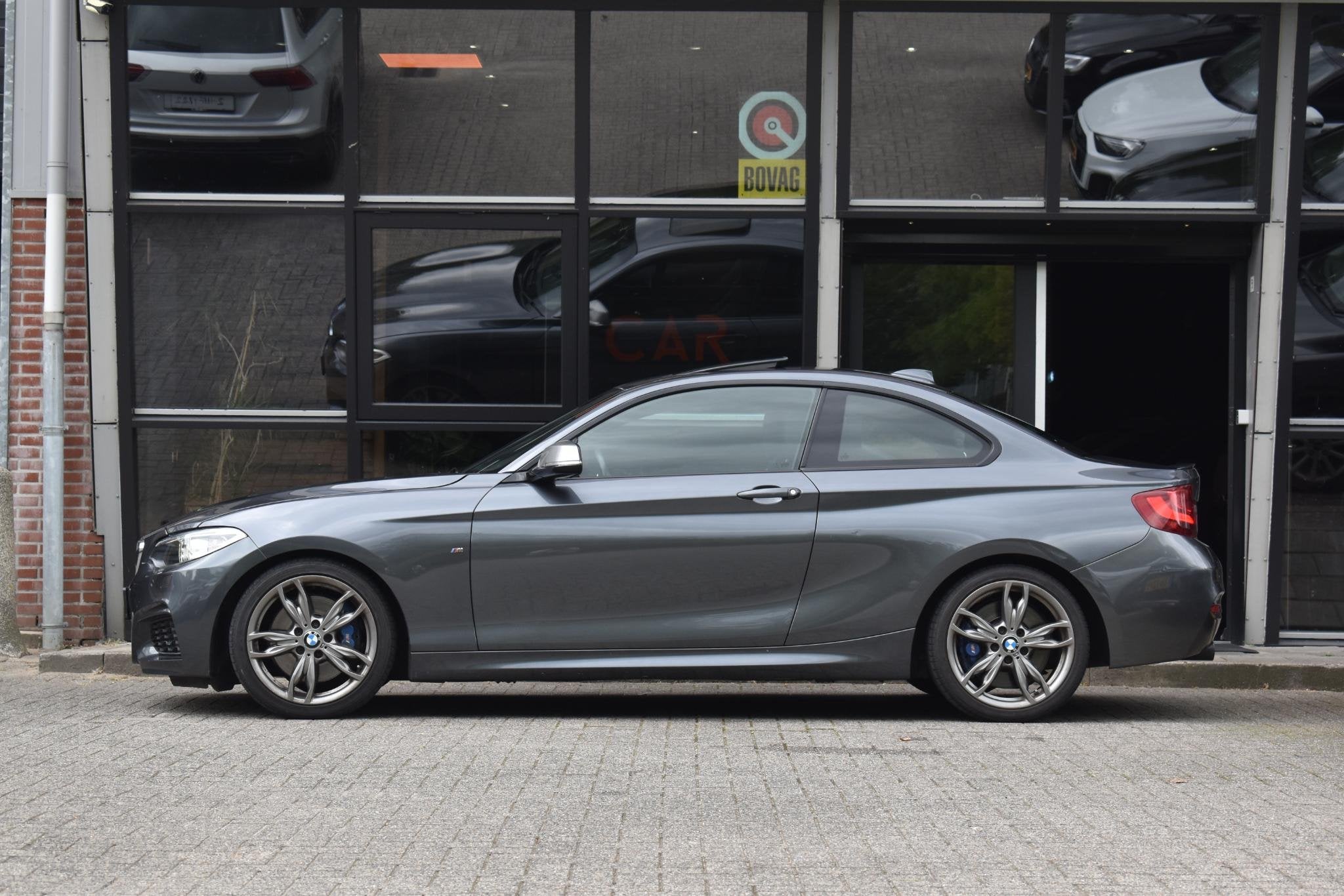 BMW 2-serie Coupé M235i High Executive Keyless Pano H/K Cam, Auto's, Dealer onderhouden, Achterwielaandrijving, Gebruikt, Euro 6