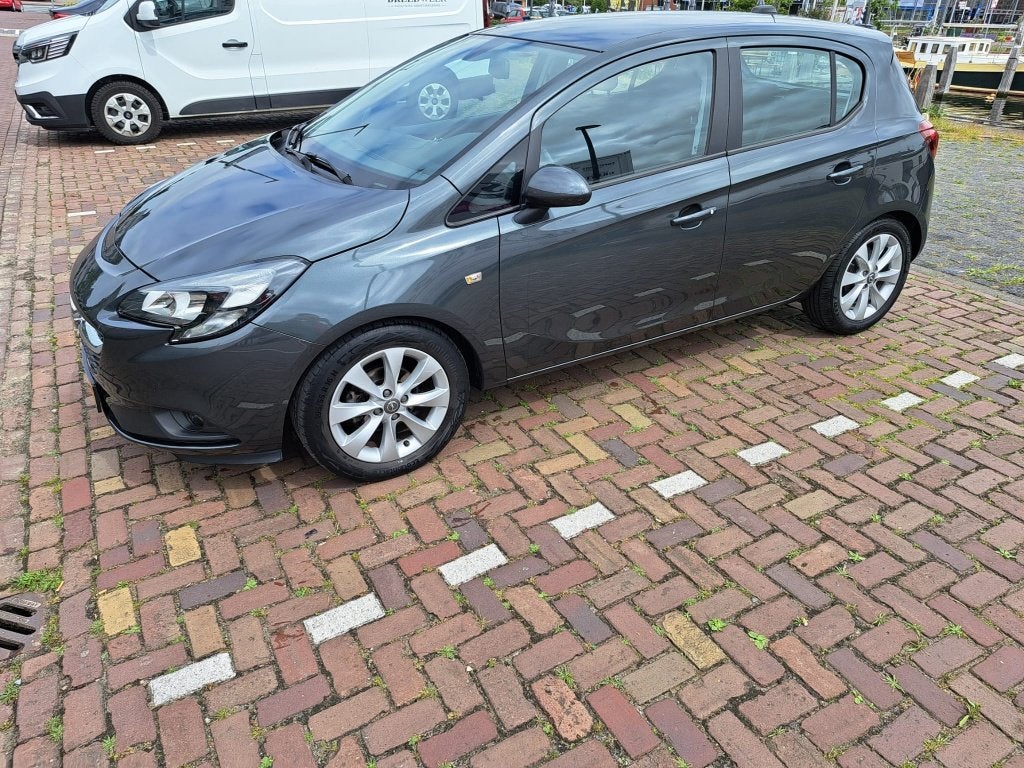 Opel Corsa 1.4 66KW/90PK 5D 2017 Grijs, Auto's, Voorwielaandrijving, 4 cilinders, 49 €/maand, Origineel Nederlands