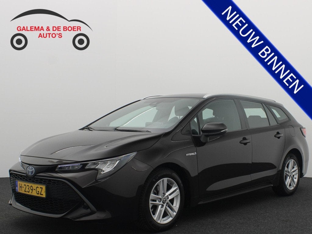 Toyota Corolla Touring Sports 1.8 Hybrid Business CAMERA / F, Auto's, Gebruikt, 4 cilinders, Bruin, Corolla
