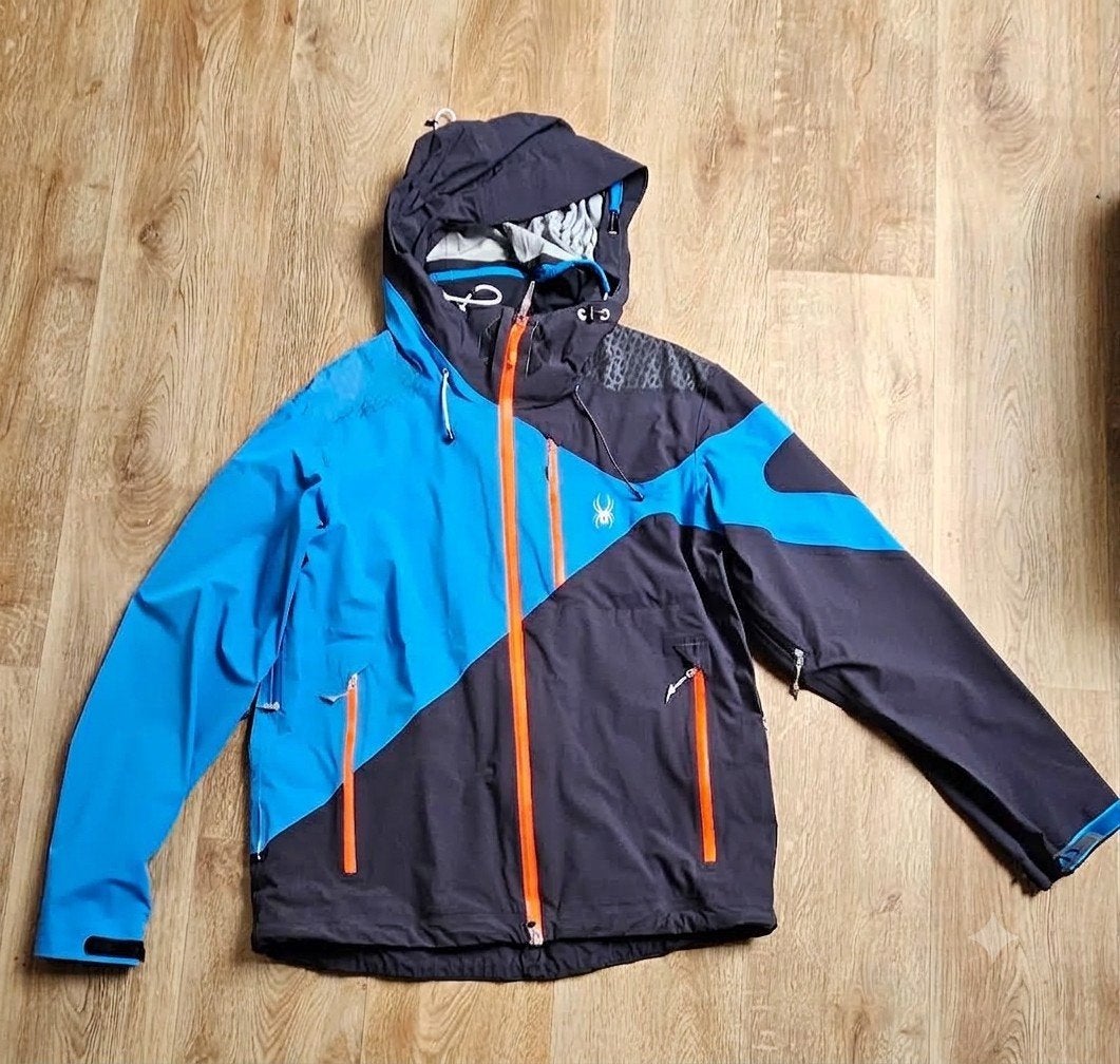 Spyder ski-jas heren - Maat L - Blauw/Zwart + oranje ritsen, Maat 52/54 (L), Ophalen of Verzenden, Zo goed als nieuw, Spyder