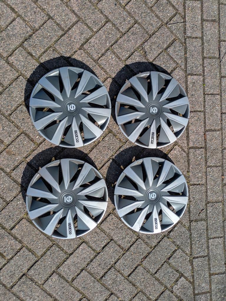 VW Polo 15 inch wieldoppen siervelgen, Ophalen, Gebruikt