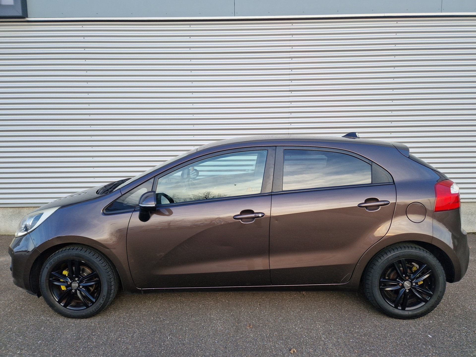 Kia Rio 1.2 CVVT Super Pack Climatronic keyless PDC NAP, Auto's, Euro 5, Gebruikt, 4 cilinders, Bruin
