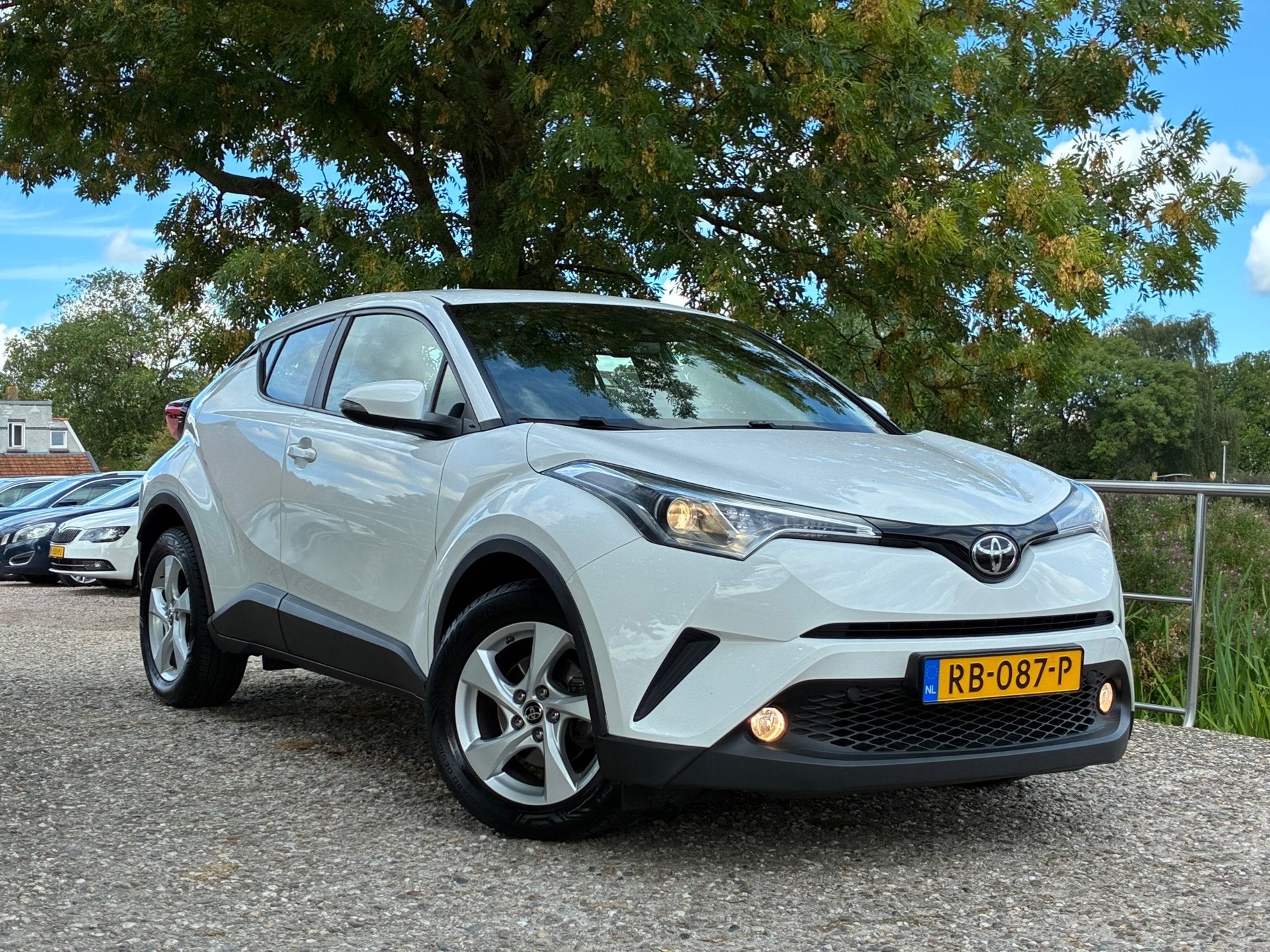 Toyota C-HR 1.2 Dynamic | Navi + Camera + Clima + Cruise Nu, Auto's, Stof, Gebruikt, 4 cilinders, 116 pk