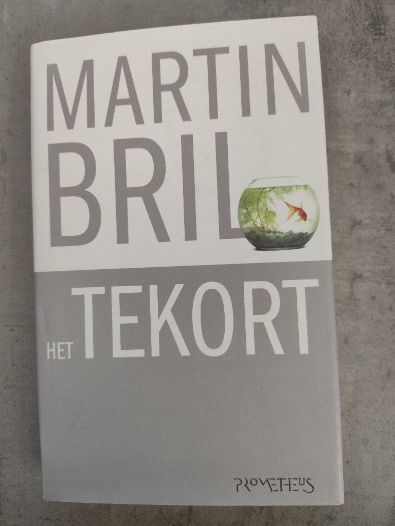 Martin Bril Het Tekort in nieuwstaat! Hard cover, Boeken, Ophalen of Verzenden, Zo goed als nieuw