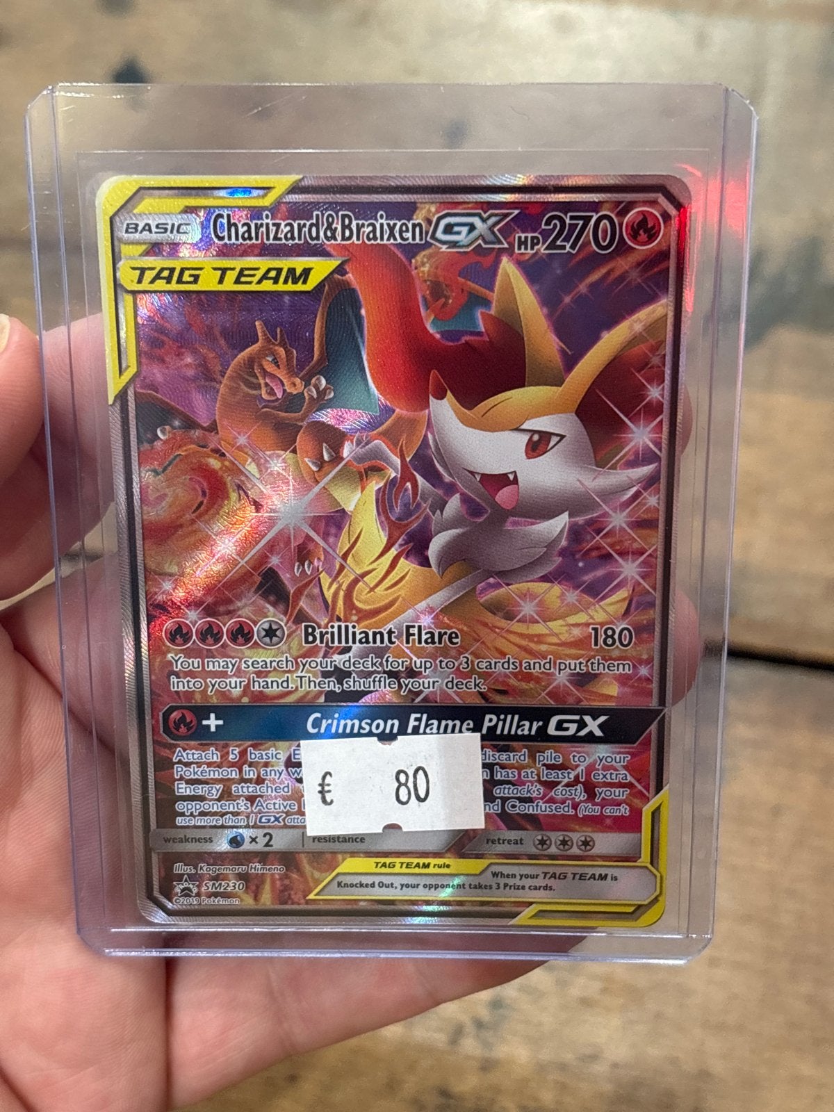 Charizard & Braixen GX SM230 Pokemon Kaart tag team, Ophalen of Verzenden, Zo goed als nieuw, Losse kaart, Foil