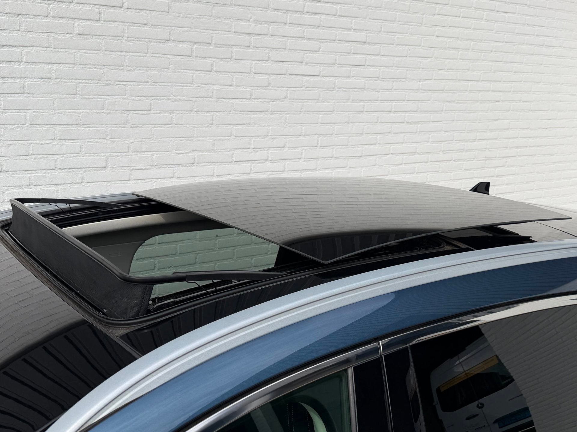 Ford Kuga 2.5 PHEV Vignale PANODAK l ACC l B&O l TREKHAAK, Auto's, Gebruikt, Zwart, 4 cilinders, Blauw