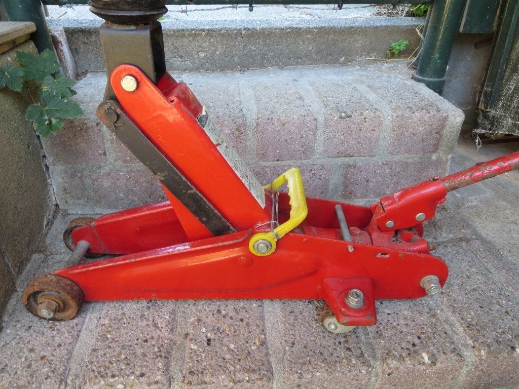 Hydraulische autokrik met stalen wieltjes, Auto diversen, Ophalen, Gebruikt, Hydraulisch, Garagekrik
