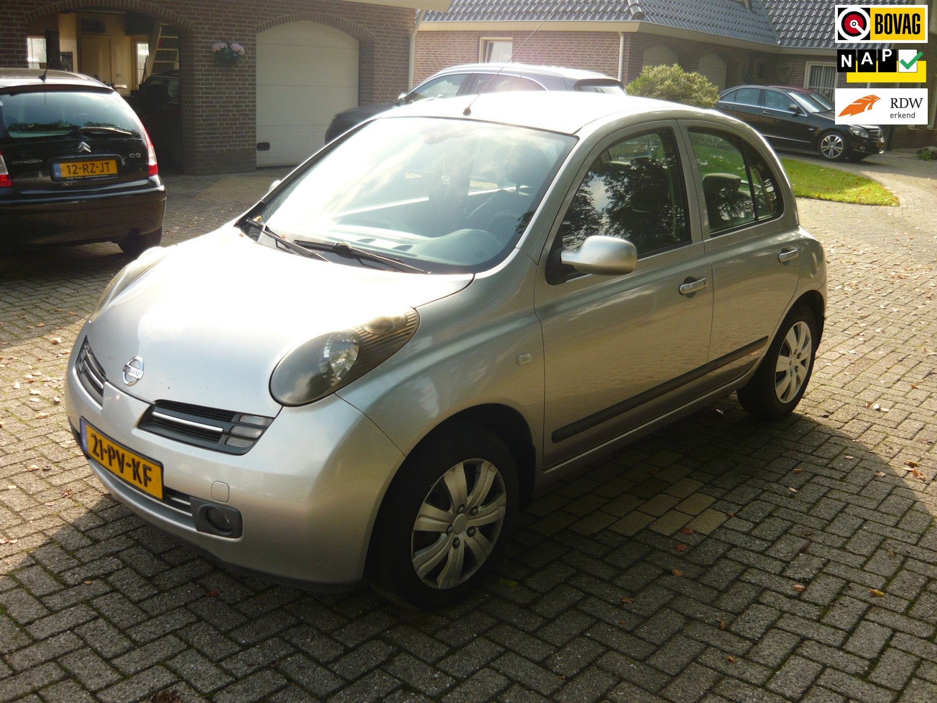 Nissan Micra 1.2 Tekna, Voorwielaandrijving, Stof, Metallic lak, 4 cilinders