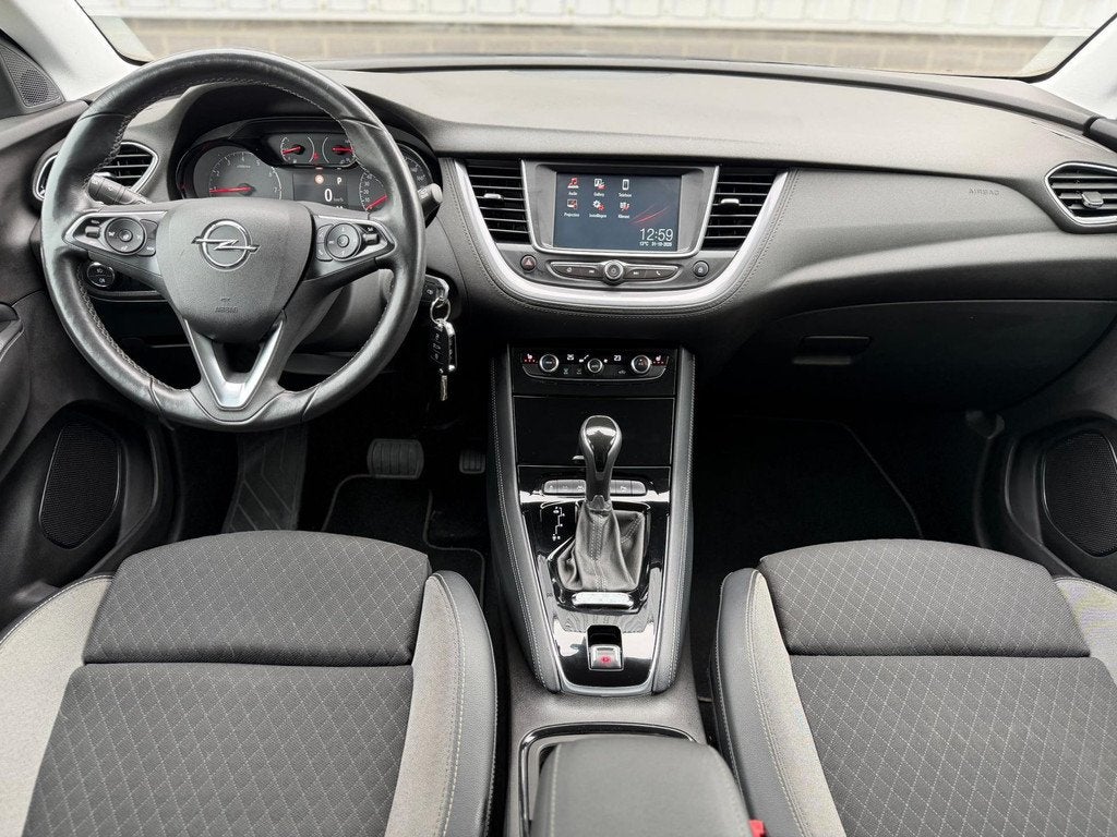 Opel Grandland X 1.2 Turbo Innovation |Automaat|Navi|Carplay, Gebruikt, 1199 cc, Leder en Stof, Zwart