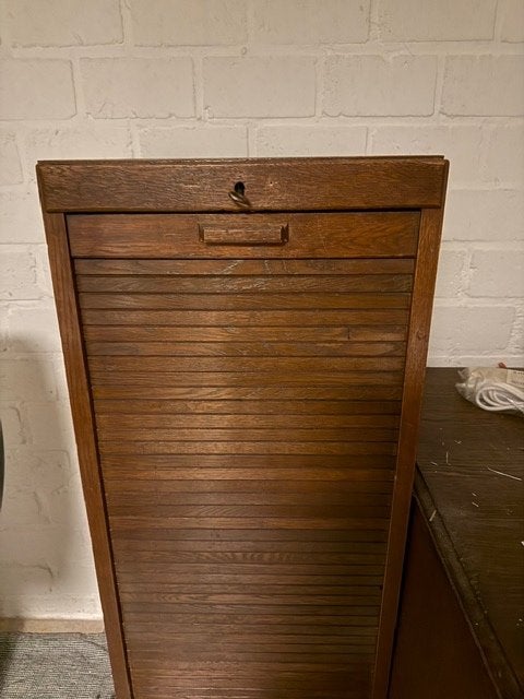 antiek roldeurkastje, Ophalen