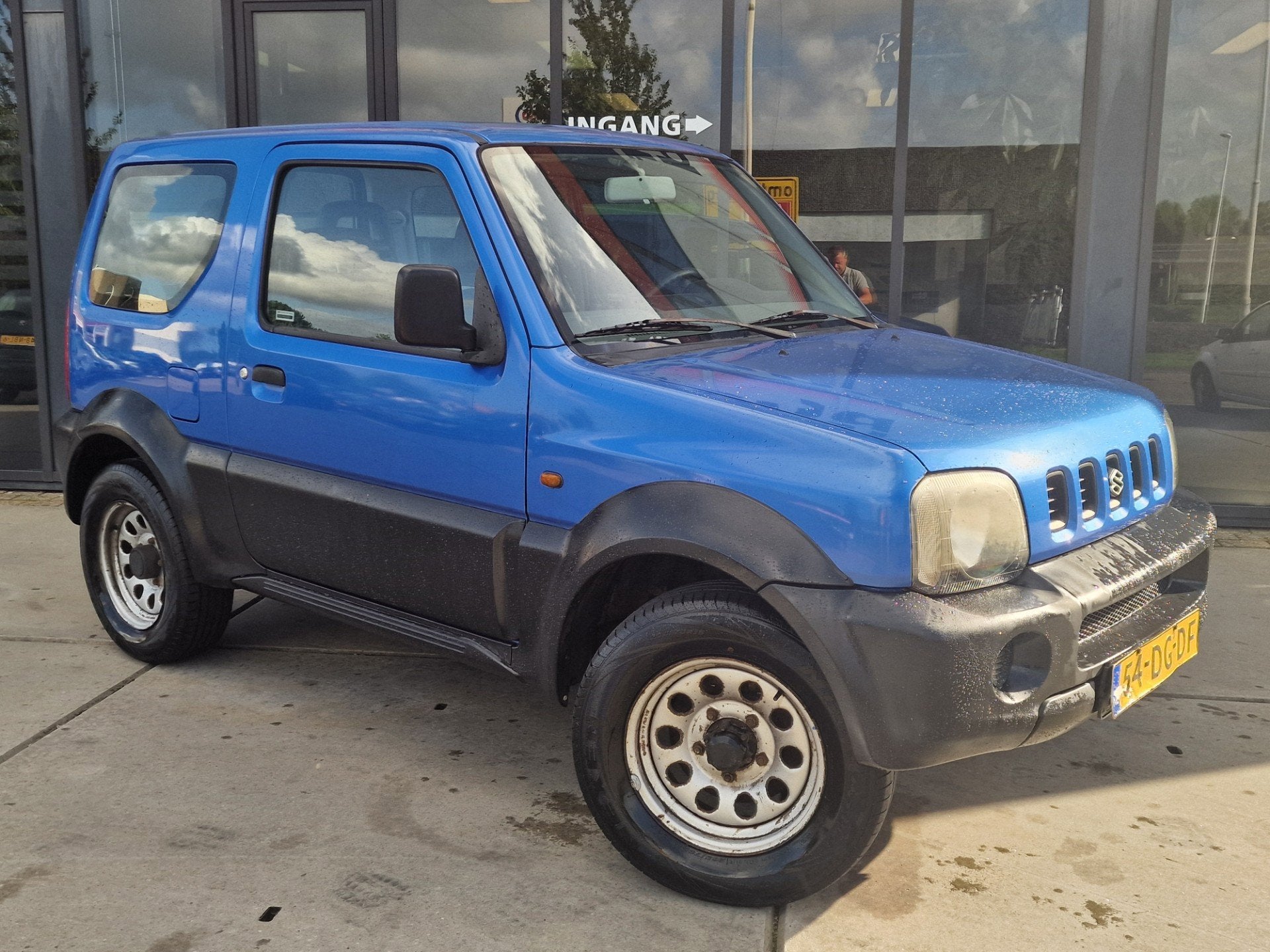 Suzuki Jimny 1.3 JX 4WD Trekhaak, Auto's, Euro 2, Zwart, 4 cilinders, Leder en Stof