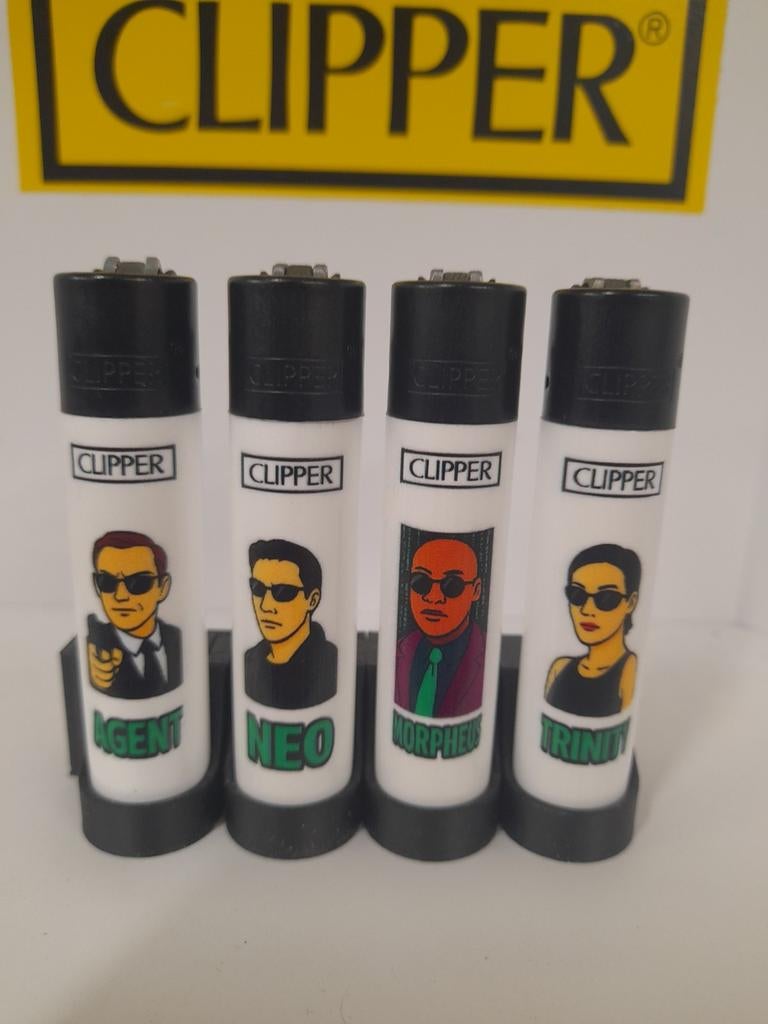 Set van 4 clipper aanstekers matrix., Verzamelen, Rookartikelen, Aanstekers en Luciferdoosjes, Ophalen of Verzenden, Nieuw, Aansteker