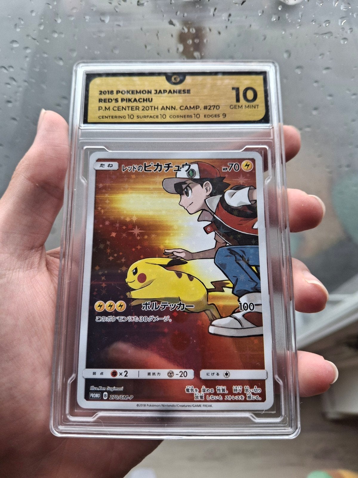 Red's Pikachu SM270 Promo - Global Grading 10 Gem Mint, Hobby en Vrije tijd, Verzamelkaartspellen | Pokémon, Ophalen of Verzenden