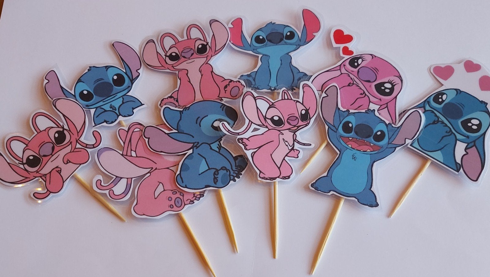 Set van 10 Stitch and Angel cupcake traktatie prikkers, Ophalen of Verzenden, Nieuw, Versiering, Verjaardag