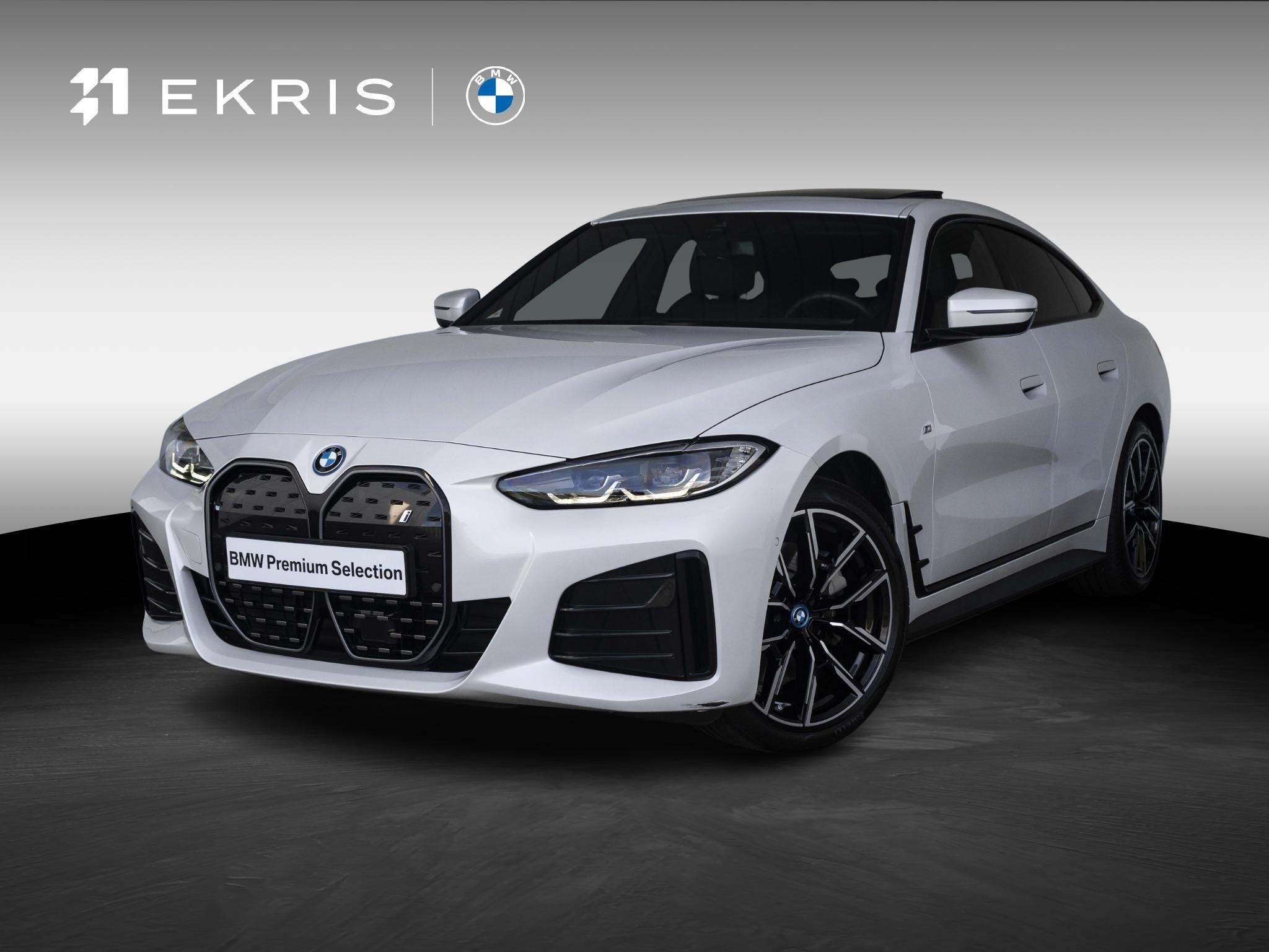BMW i4 eDrive35 70 kWh | M Sport Pakket | Schuif/Kantel Dak, Auto's, Achterwielaandrijving, Gebruikt, Met garantie (alle), Wit