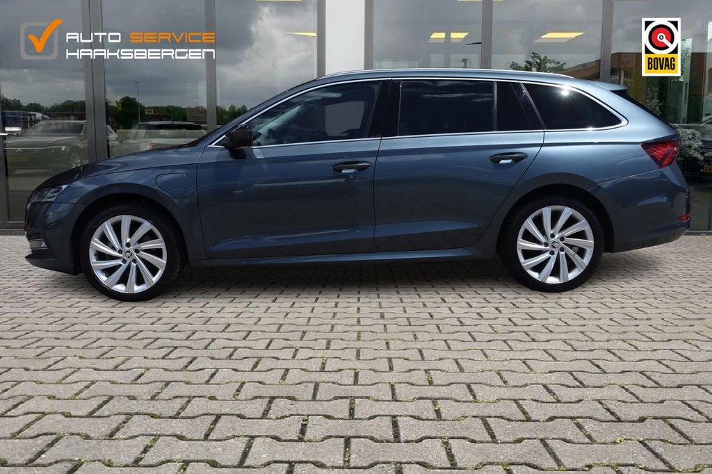 Skoda Octavia Combi 1.4 TSI iV PHEV Business Edition | ACC |, Auto's, Skoda, Gebruikt, Leder en Stof, Plug-in hybride, 1500 kg