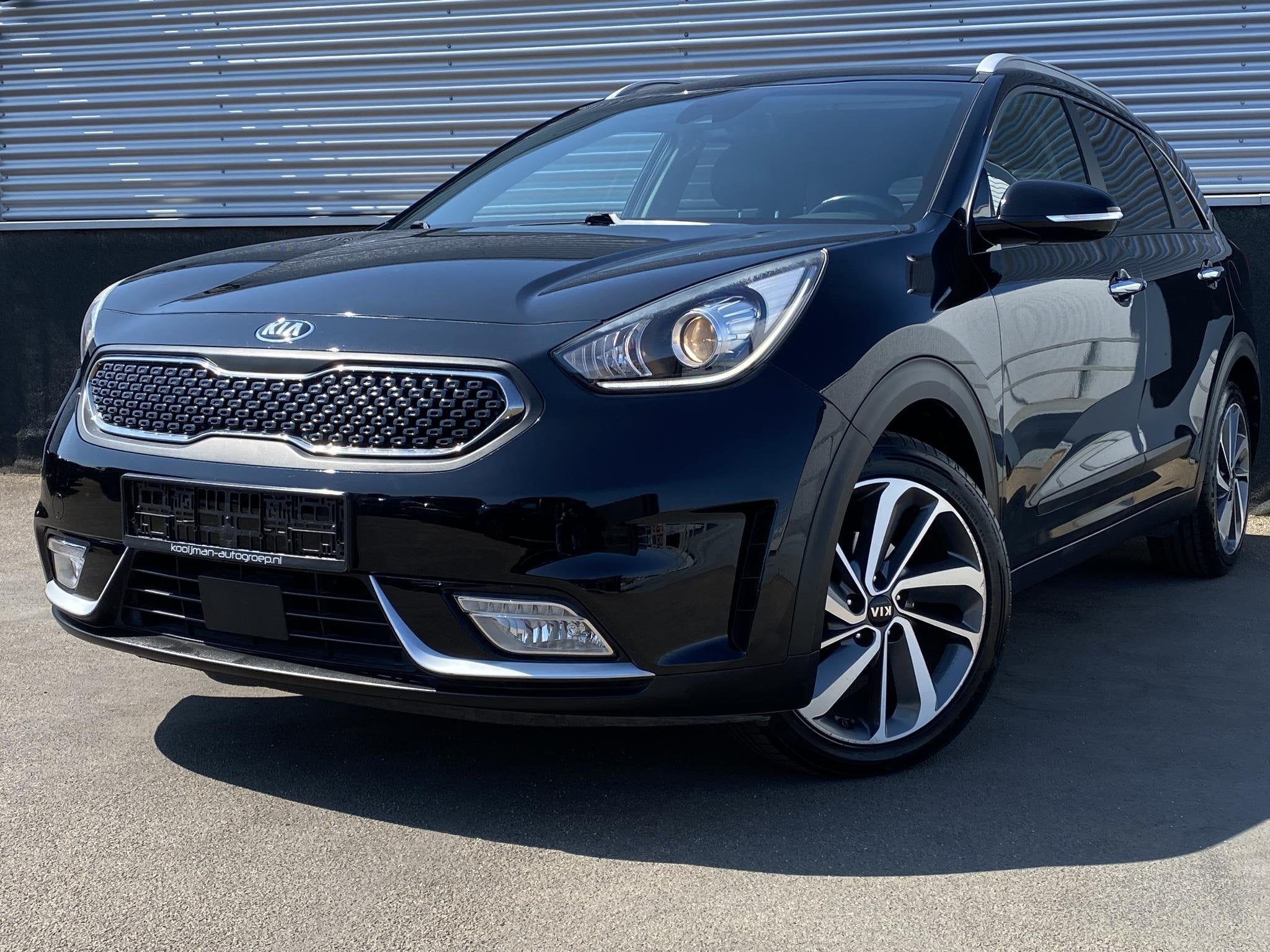 Kia Niro 1.6 GDi Hybrid DynamicLine Edition Navigatie, Apple, Auto's, Gebruikt, Euro 6, 2 kWh, Leder en Stof