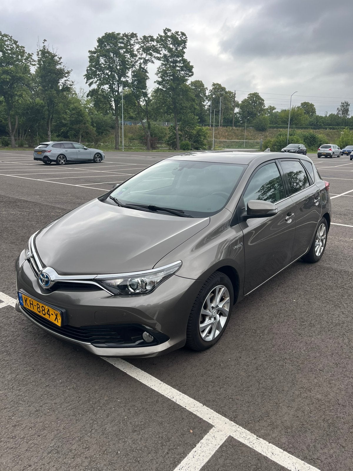 Toyota Auris 1.8 Hybrid Dynamic 2016 Bronz, Auto's, 28 km/l, Origineel Nederlands, Overige kleuren, Auris