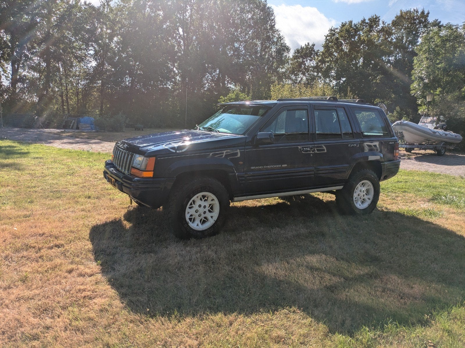 Jeep Grand Cherokee 5.2 I V8 LPG Limited AUT 1997 Blauw, Auto's, Automaat, 5216 cc, Blauw, Origineel Nederlands