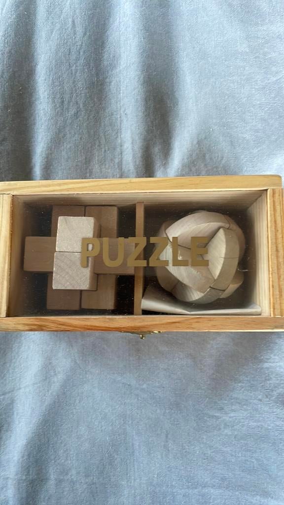 2 houten puzzels met uitleg en doosje, Ophalen of Verzenden, Minder dan 500 stukjes, Zo goed als nieuw, Rubik's of 3D-puzzel