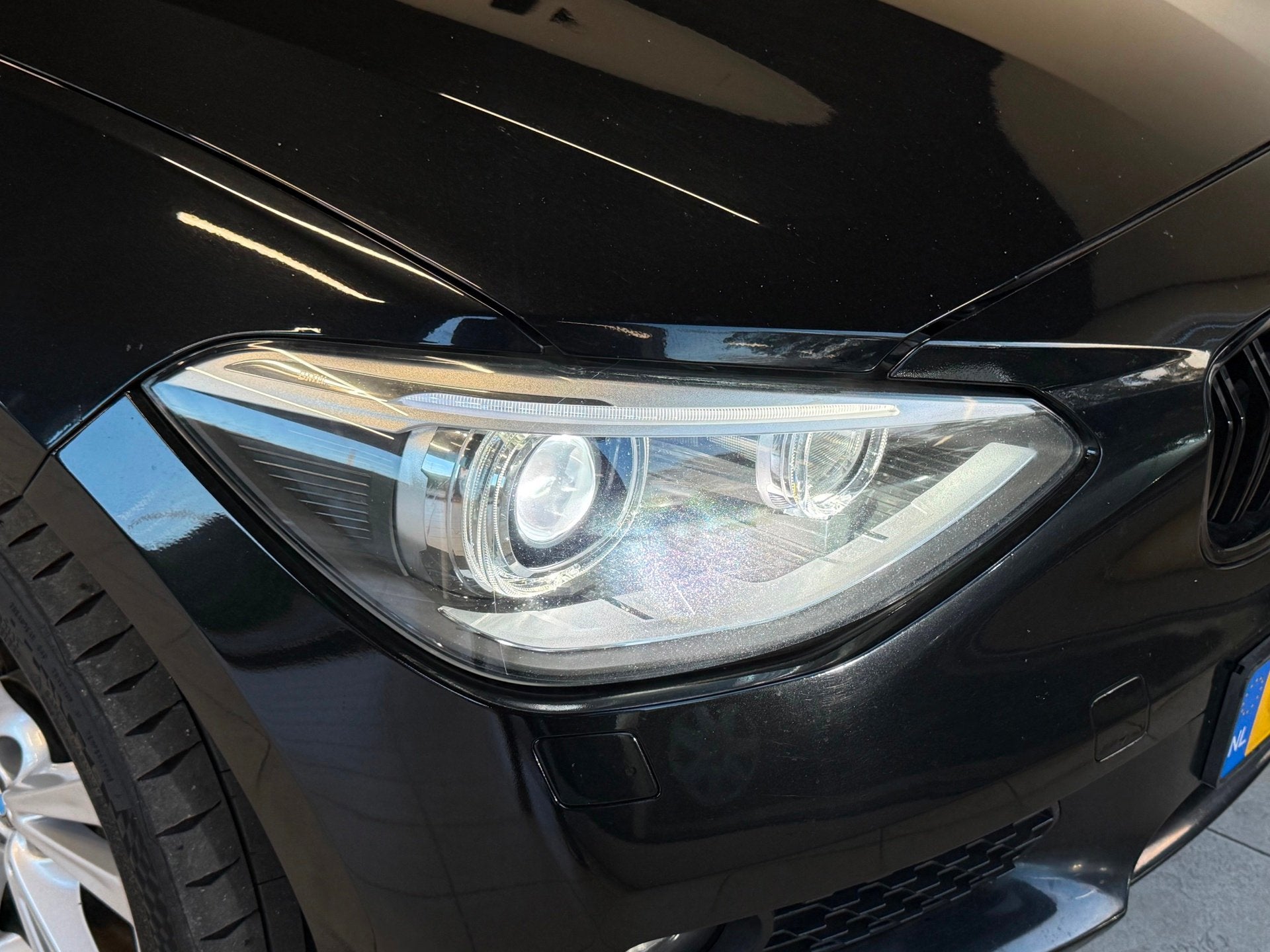 Foto 18 van BMW 1-serie 116D Business 2012 Zwart AIRCO|NAVI|XENON|NAP!