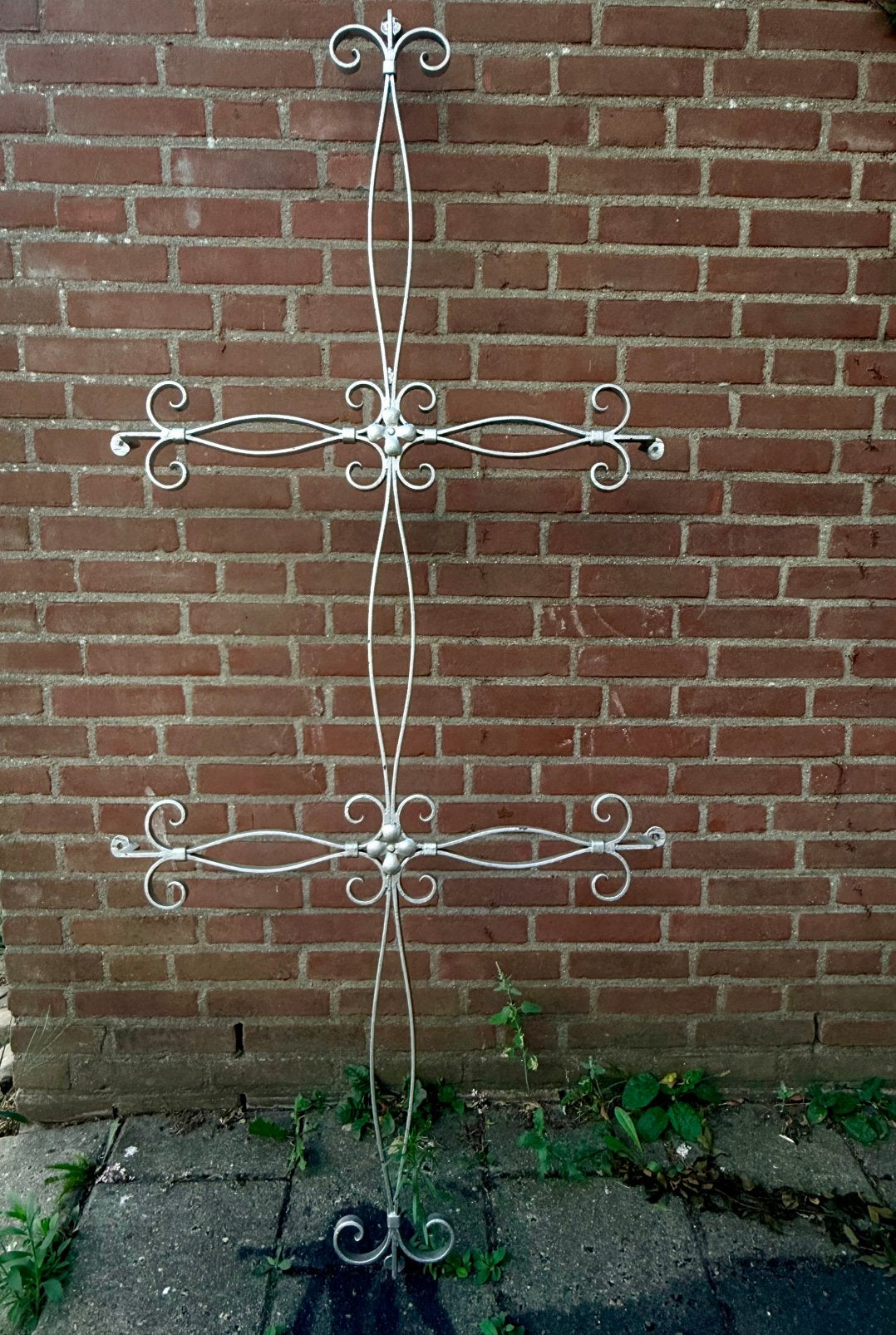 Handgesmeed ijzeren deurrooster, Ophalen