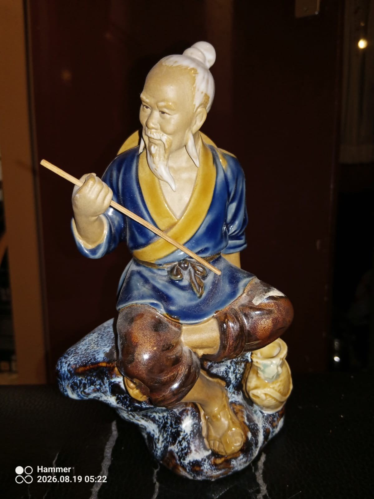 Mudman Shiwan Visser in blauwe kimono met stok/vishengel, Ophalen