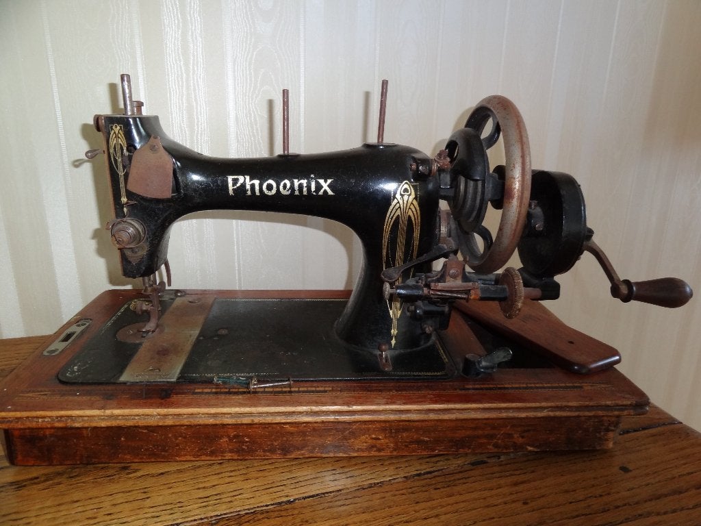 Phoenix naaimachine, Ophalen