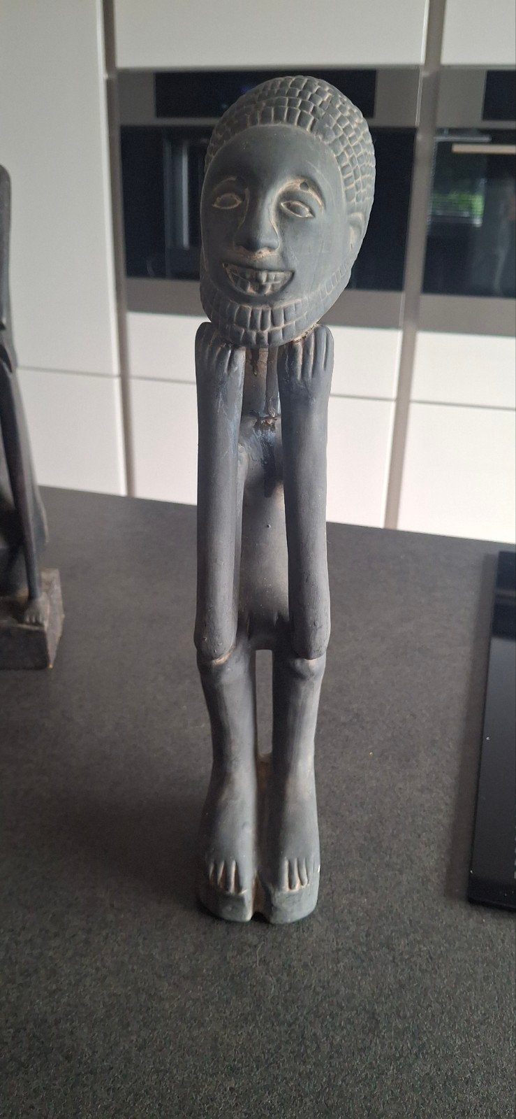 Stenen afrikaansbeeld, Ophalen