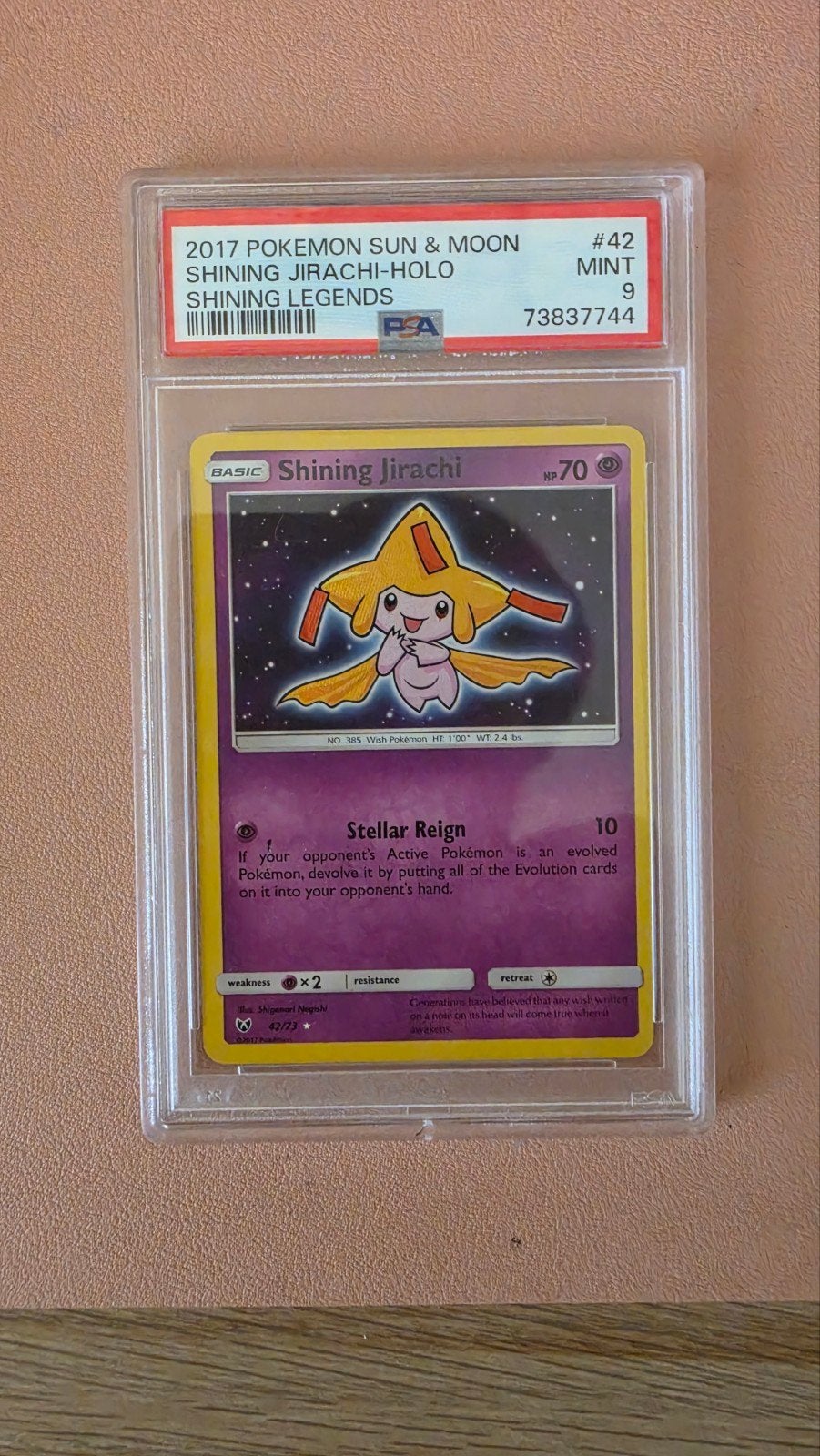PSA 9 Shining Jirachi Holo Pokémon Kaart - Sun & Moon #42, Ophalen of Verzenden, Zo goed als nieuw, Losse kaart, Foil