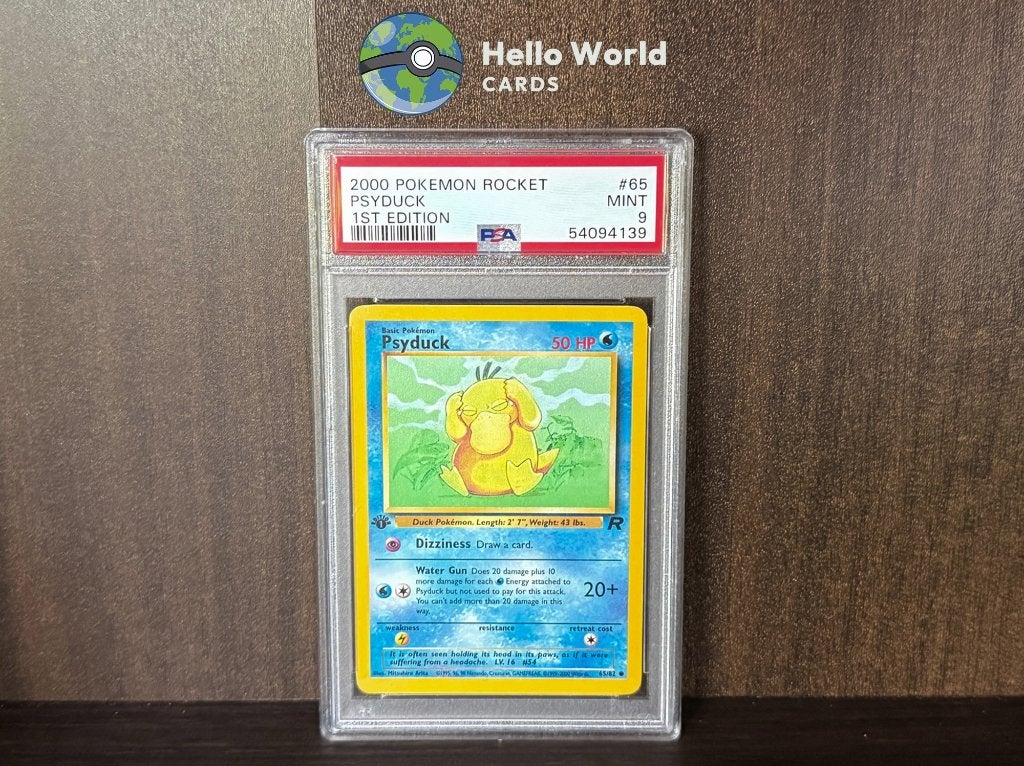 Psyduck 1st Edition 65/82 - PSA 9 - Team Rocket, Ophalen of Verzenden, Zo goed als nieuw, Losse kaart, Foil