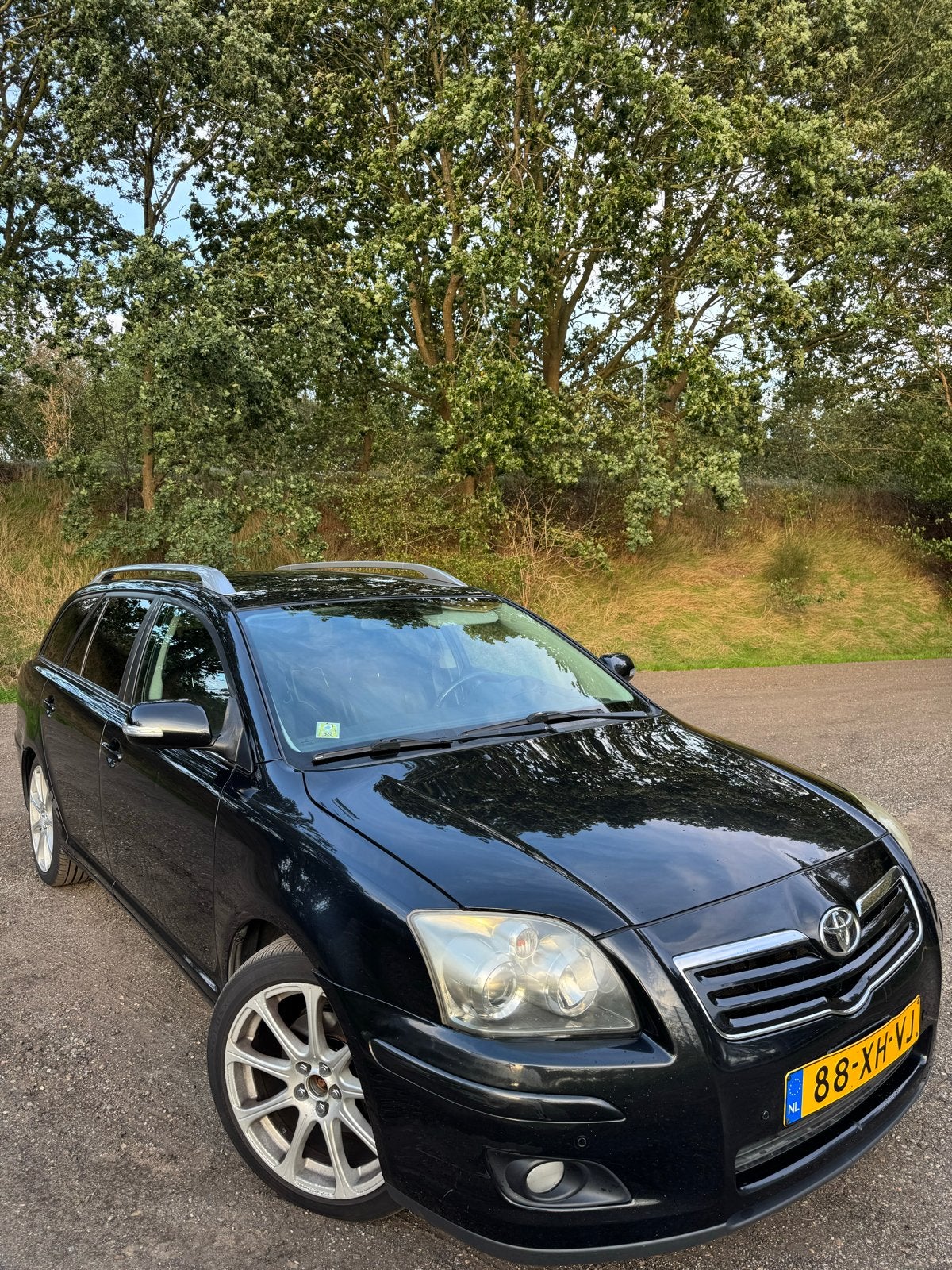Toyota Avensis 2.4 16V Vvt-i Wagon Leer AUT 2007 Zwart, Auto's, Avensis, Zwart, 4 cilinders, Automatische klimaatregeling