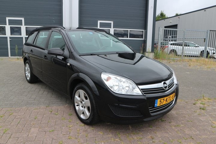Opel Astra Wagon 1.6 Cosmo (bj 2010), Voorwielaandrijving, 657 kg, Gebruikt, Zwart