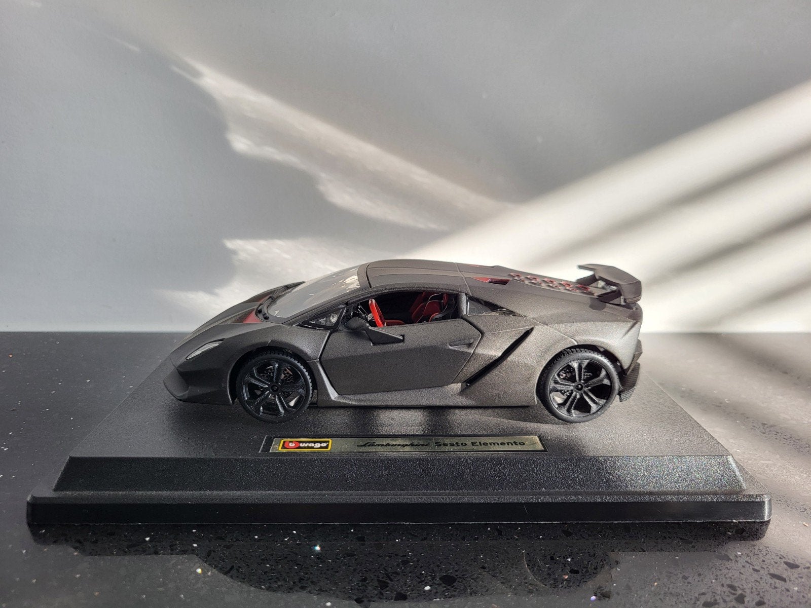 Lamborghini Sesto Elemento grijs 1/24 Bburago, Ophalen of Verzenden, Zo goed als nieuw, Auto, Bburago