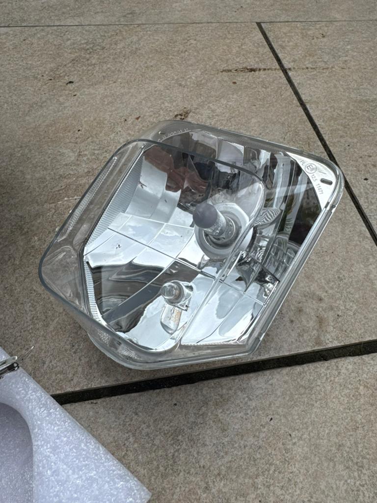 Husqvarna 701 - Originele koplamp - Nieuw ongebruikt, Motoren, Ophalen of Verzenden