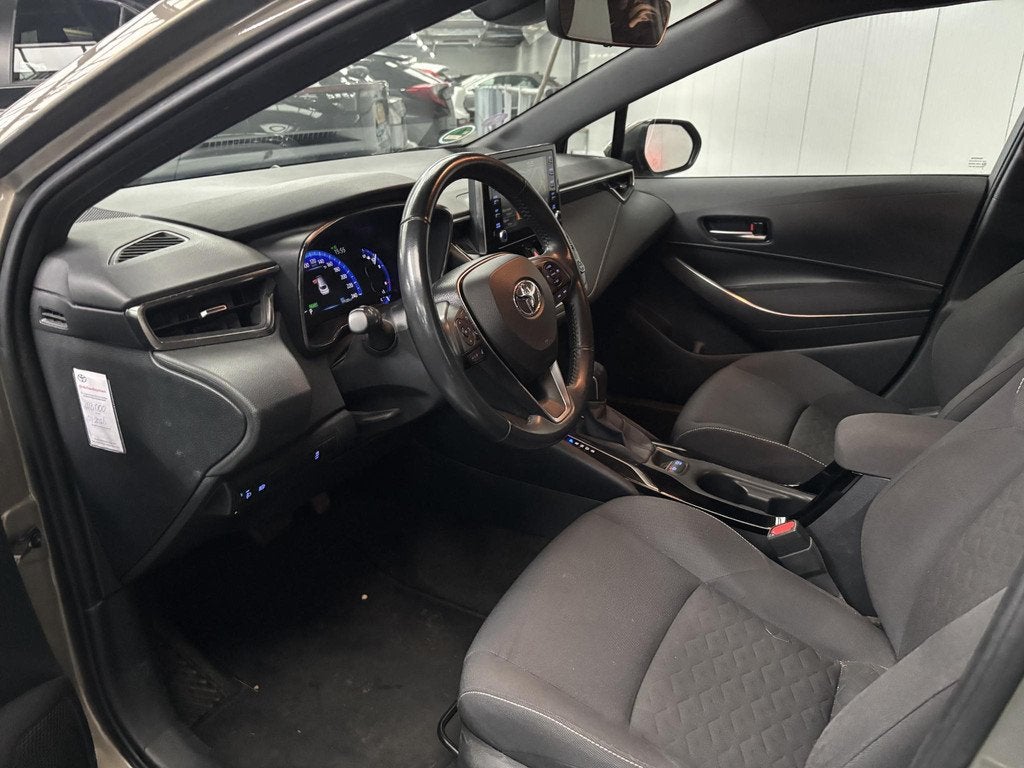 Toyota Corolla Touring Sports 1.8 Hybrid Business Plus, Auto's, Gebruikt, 4 cilinders, Corolla, 122 pk
