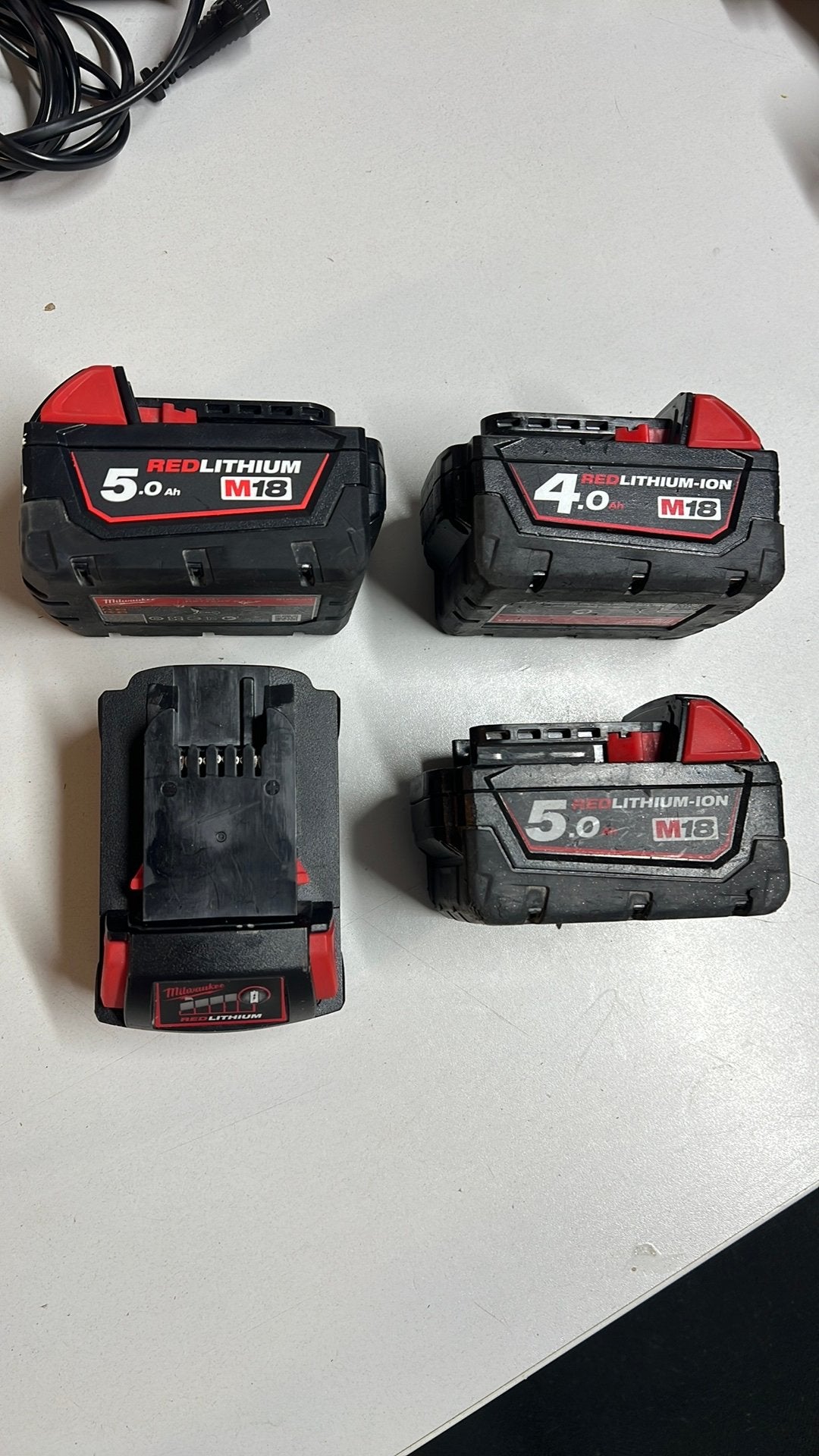 Milwaukee Accus Red Lithium M18, Ophalen of Verzenden, Zo goed als nieuw
