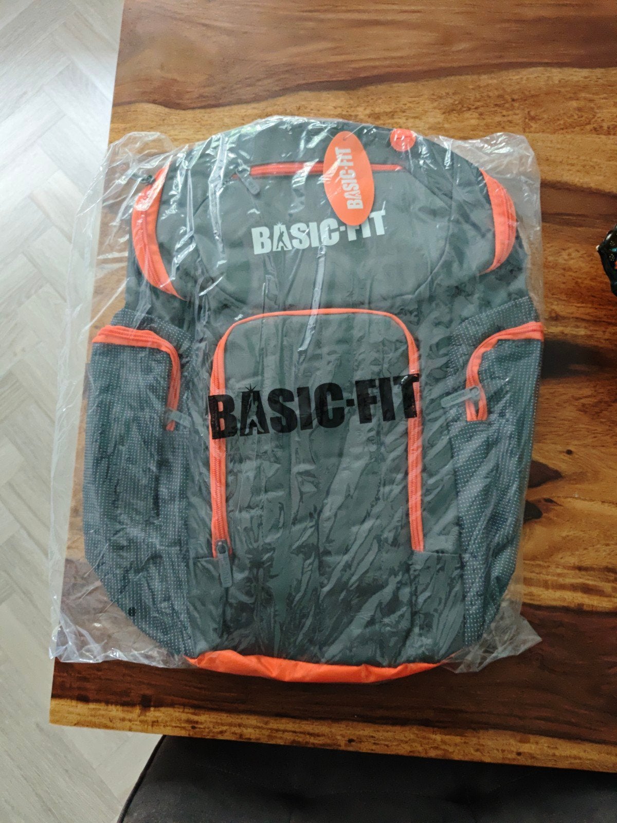 Nieuwe Basic-Fit rugzak - Grijs/Oranje, 25 tot 40 cm, Nieuw, Ophalen of Verzenden, Overige merken